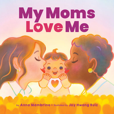 Illustrated cover of two women, one with light skin tone and long brown hair, wearing a white shirt. One has dark skin tone and short dark curly hair. They are facing each other with a baby in between and they are each kissing the baby's cheeks. The baby is wearing a bib with a orangey heart. Light pink blue gradient background with yellow heart-shaped flowers in the foreground. The title reads in purple and pink